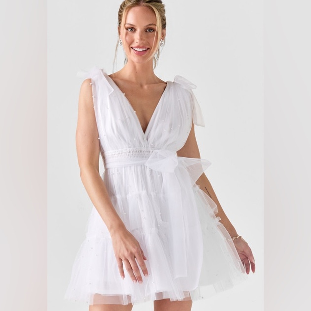 Francesca’s tulle tiered pearl dress